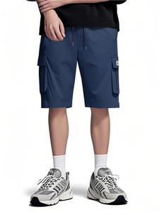 Detailed close-up of navy blue cargo shorts with drawstring waist and flap pockets