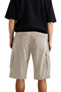 Rear view of khaki cargo shorts with functional back pockets and straight cut fit