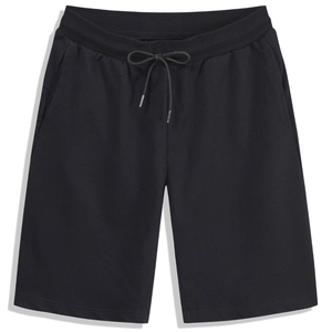 Men's loose black athletic shorts with elastic waistband and drawstring in flat lay view