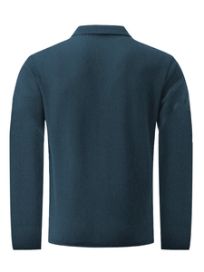 Detailed back view of dark blue waffle knit texture on a long-sleeve polo shirt