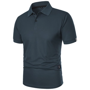 Detail of dark grey-blue men's polo shirt featuring ribbed cuffs and side hem label