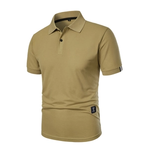 Close-up of khaki polo shirt collar with black placket and classic wear hem label