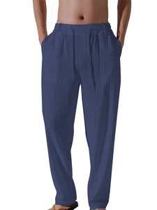 Close-up of deep blue linen joggers with elastic drawstring waist and pocket details