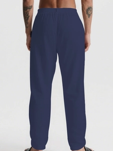 Rear view of men's navy blue casual linen pants with comfortable elastic drawstring waist