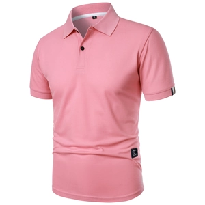 Detail view of pink polo shirt showing breathable mesh fabric and classic collar design