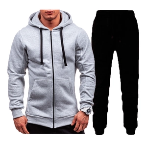 Men's casual tracksuit set featuring a grey zip-up hoodie and minimalist black joggers