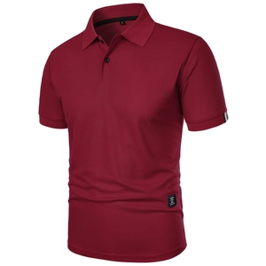 Detail of burgundy polo shirt with ribbed striped cuffs and classic wear brand label