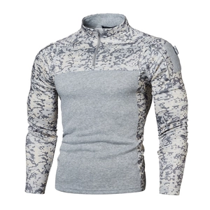 Detail of gray camo tactical jogging shirt showing 1/4 zipper collar and sleeve patch area