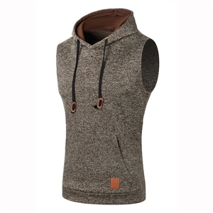 Detail view of brown fleece knit hooded vest with leather logo patch and drawstring