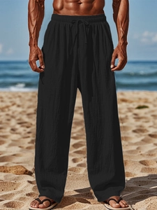 Detail of men's breathable cotton linen pants with adjustable drawstring elastic waist