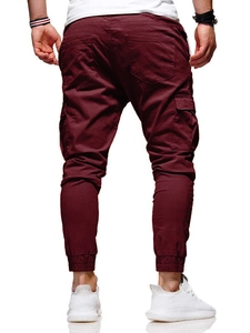 Rear view of men's burgundy jogger pants featuring cargo pockets and ribbed cuffs