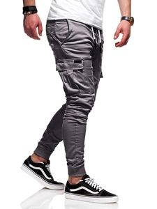 Detailed view of grey cargo joggers with drawstring waist and large side flap pockets