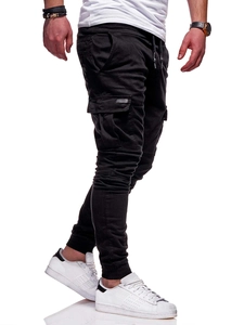 Detail of cargo jogger pants featuring side flap pockets and elastic drawstring waist