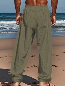 Detail of olive green breathable linen pants for men with comfortable elastic waist