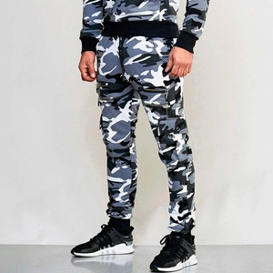 Detail of men's slim fit camo joggers featuring multi-zipper pockets and cargo styling