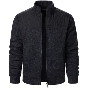 Detail of grey knit cardigan featuring black quilted shoulder patches and metal zipper