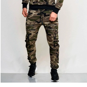 Detail of men's camo jogger pants featuring utility side pockets and dual metal zippers