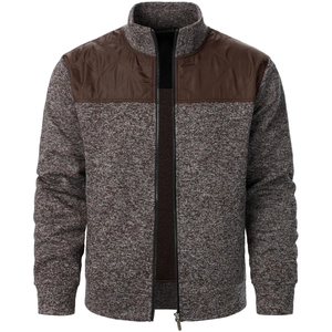 Detail of men's knit cardigan featuring brown quilted shoulder panels and zipper neck