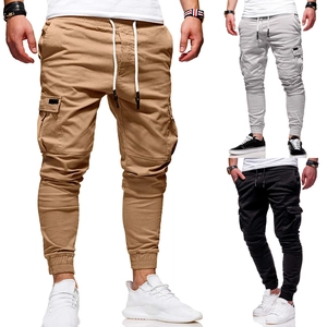 Detail of drawstring waist and side cargo pockets on multi-color slim jogger pants