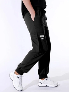 Detail of men's black cargo joggers featuring large side pockets and drawstring waist
