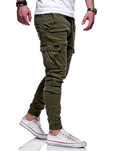 Detail of army green cargo joggers with large utility side pockets and cuffed hems