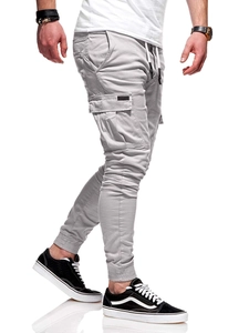 Detail of light grey cargo pants showing drawstring waist and 3D flap pockets on side