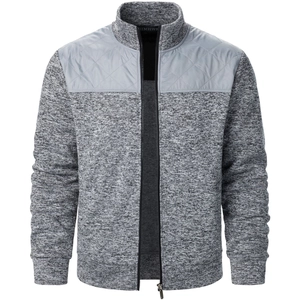 Detail of men's grey knit cardigan jacket with quilted windproof chest panel and zipper
