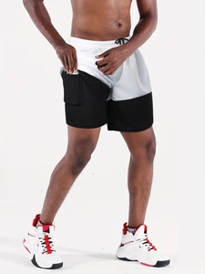 Detail view of double-layer running shorts with hidden phone pocket on inner compression liner