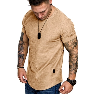 Detail view of khaki slim fit men's T-shirt with curved hem and small decorative side label