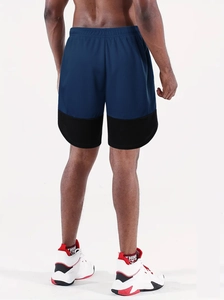 Rear view of navy blue and black patchwork quick-dry running shorts with elastic waistband