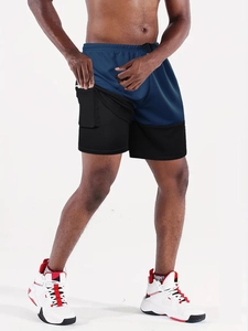 Detail of men's blue running shorts with inner compression layer and hidden phone pocket