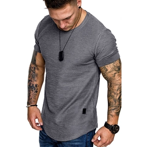 Detailed view of dark grey T-shirt featuring a unique slub texture and curved hem