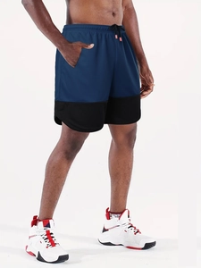 Detail of navy blue running shorts showing breathable mesh fabric and elastic drawstring