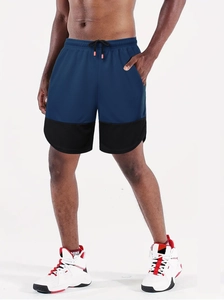 Detail of navy and black running shorts featuring breathable mesh texture and drawstring waist