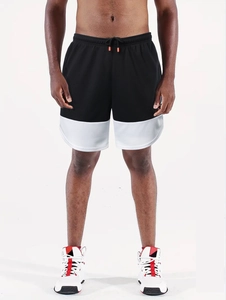 Detail of running shorts featuring a mesh fabric, bicolor design, and adjustable drawstrings