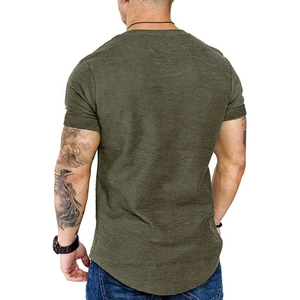Detail view of military green t-shirt showing waffle texture and curved hemline