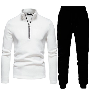 Men's two-piece winter tracksuit with white quarter-zip sweatshirt and black joggers