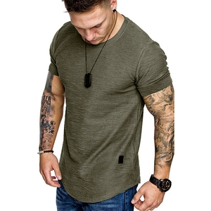 Close-up of olive green t-shirt with slub texture, curved hem and small logo detail