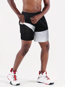 Detail view of double-layer running shorts showing the built-in phone pocket on inner liner