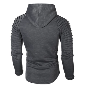 Detail view of men's slim fit hoodie with ribbed pleats on raglan sleeves and curved hemline