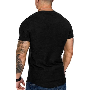 Close-up of black men's slim fit T-shirt showing textured fabric and curved hem design