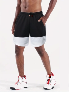 Detail of running shorts with breathable mesh fabric and black-white contrast panels