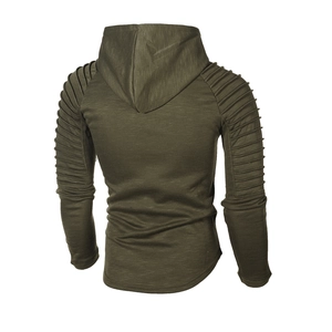 Detailed close-up of ribbed texture and horizontal pleats on the olive green hoodie sleeve
