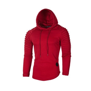 Detail of red men's hoodie featuring ribbed pleated sleeves and sleek hood drawstring