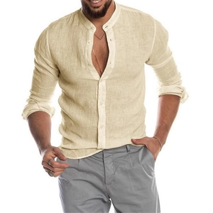 Detail of men's linen shirt showing beige fabric texture, mandarin collar and white buttons