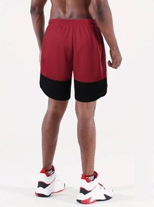 Rear view detail of breathable red and black mesh sports shorts for men's running