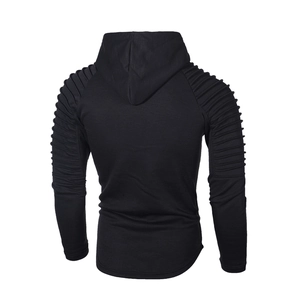 Detail of black slim fit hoodie showing unique horizontal pleated sleeves and knitted texture