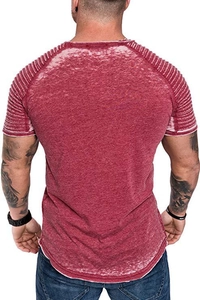 Detail view of red acid wash t-shirt with ribbed pleats on shoulders and curved hemline