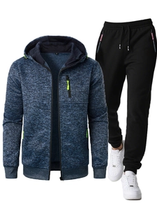 Detail of men's hooded tracksuit with jacquard texture jacket and black joggers
