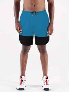 Detail of blue and black patchwork sports shorts with adjustable drawstring waist for men